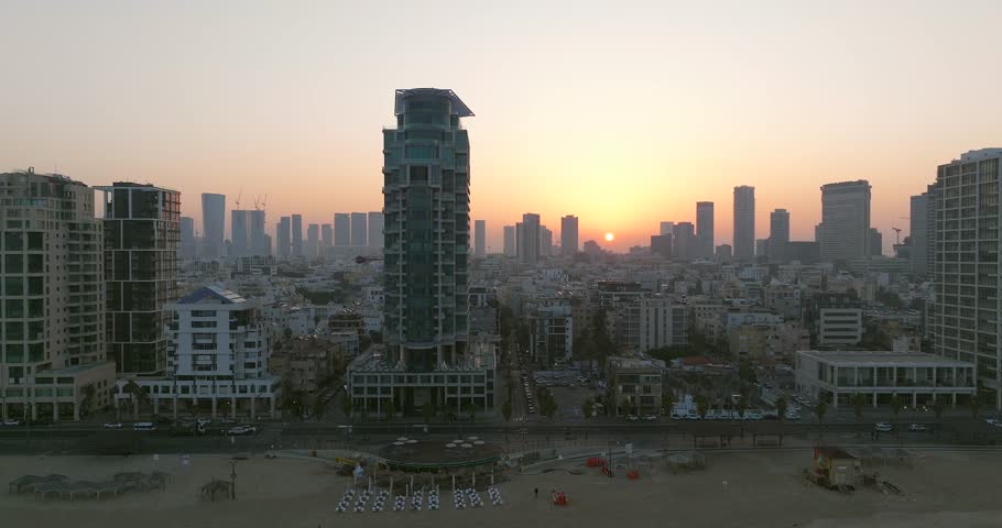 Low aerial pass of Tel Aviv city coastline and The Mediterranean beach 