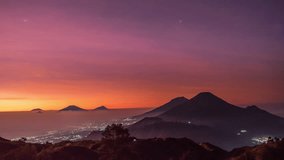 Mount Prau, Wonosobo, Central Java. timelapse The sun starts to rise and slowly the cold atmosphere turns warm. There are five mountains that can be seen by Sindoro, Sumbing, Merapi, Merbabu, and Lawu