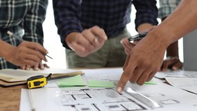 Architect team meeting, Group of architects and contractor engineers meet to discuss the design and layout of the construction project. - Powered by Shutterstock - Get 15% off with code: PIKWIZARD15