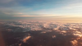 Beautiful sunset sky above clouds with dramatic light. Cabin view from airplane - Powered by Shutterstock - Get 15% off with code: PIKWIZARD15