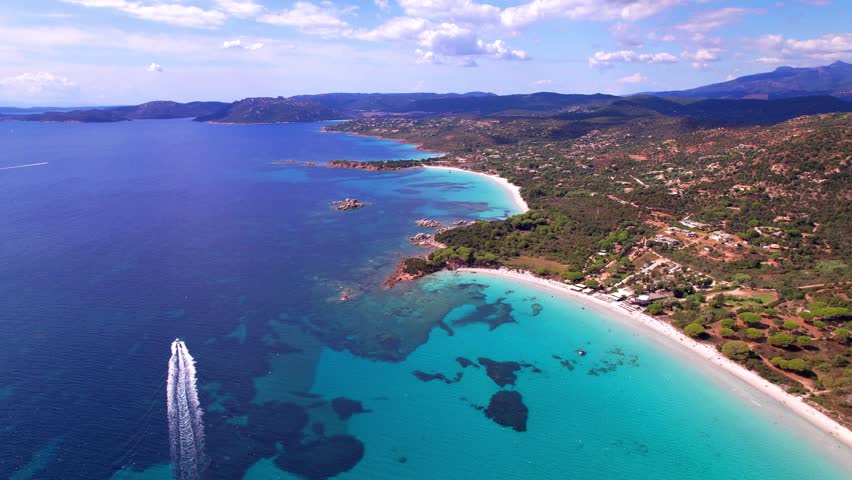 Best beaches of Corsica island. Aerial drone video of three beaches near Porto Vecchio - Palombaggia, Tamaricciu, Folaca with turquoise sea and white sand
