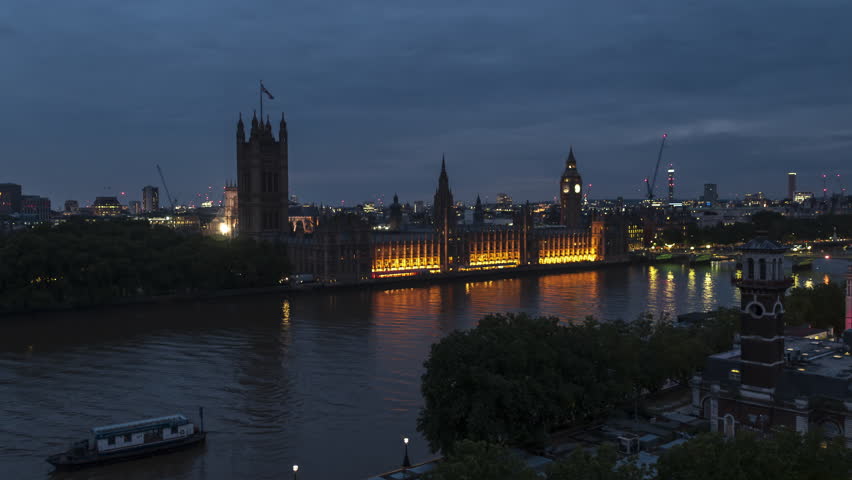 Establishing Aerial View Of London Skyline, Westminster Big Ben, British Parliament, night, evening, push in low Royalty-Free Stock Footage #1101506301