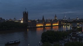 Establishing Aerial View Of London Skyline, Westminster Big Ben, British Parliament, night, evening, push in low