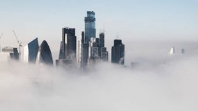 Square Mile, City of London, Establishing Aerial View Shot of London UK, United Kingdom, clouds fog, tracking left