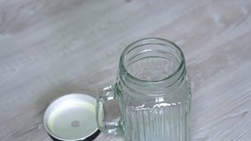 Milk shake with straw preparation footage. Concept of healthy lifestyle. Pouring protein smoothie in glass