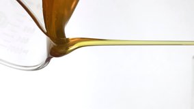 Motor oil pouring on white background
 - Powered by Shutterstock - Get 15% off with code: PIKWIZARD15