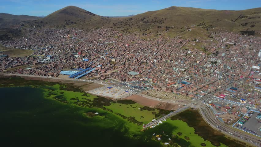 Aerial panorama of Puno with Lake Titicaca in Peru, South America