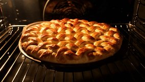 Tasty pie in oven. Timelapse of homemade pie baked. Baking concept. Delicious Apple Pie rising up in oven. Process of baking berry pie with apples baked in oven. 4K, UHD - Powered by Shutterstock - Get 15% off with code: PIKWIZARD15