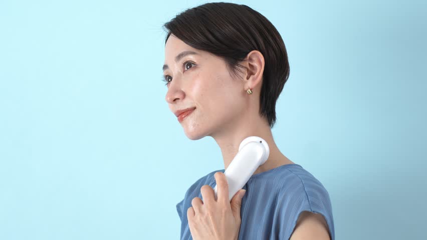 Japanese woman using facial equipment | Shutterstock HD Video #1101525361
