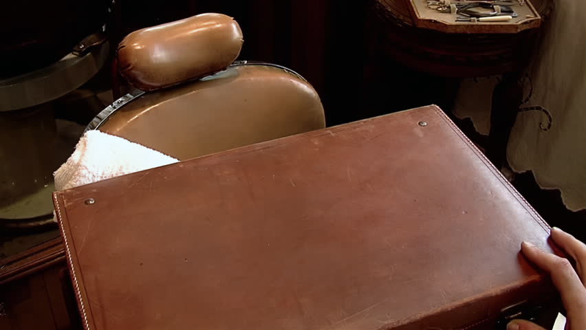Hairdresser Sorting his Barber Shop Tools, Set of Various Professional Barber Tools in Hair Salon. Close Up.