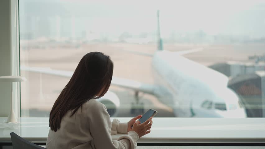 Upset and frustrated passenger waiting for flight delays for a long time Royalty-Free Stock Footage #1101531797