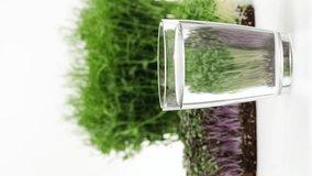 Detox drink with Chlorophyll extract and microgreen, micro greens. Concept of superfood, healthy eating, eco organic vegan food, detox drink, dieting, diet, closeup, vertical video