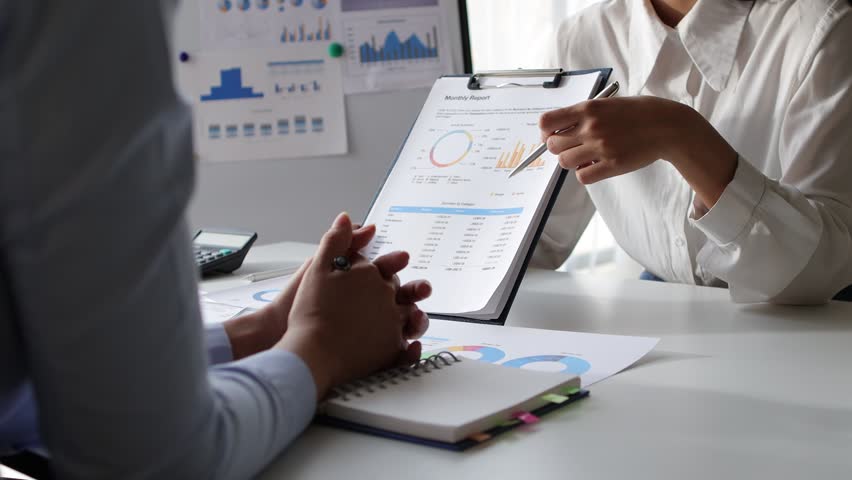 Meeting business people brainstorm to analyze charts in business finance report, financial and investment account planning. Discuss the analysis of the market growth situation and the company's sales. Royalty-Free Stock Footage #1101543555