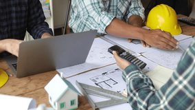 Architect team meeting, Group of architects and contractor engineers meet to discuss the design and layout of the construction project. - Powered by Shutterstock - Get 15% off with code: PIKWIZARD15