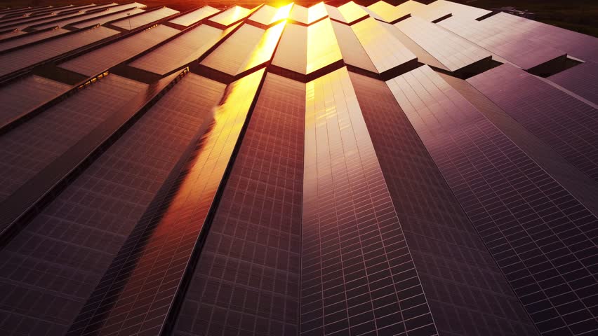 Slow motion aerial of photovoltaic solar power station technology at sunset | Shutterstock HD Video #1101544769