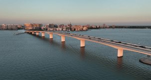 Evening aerial video of the Sarasota, Florida Skyline and Bridge Across Sarasota Bay	