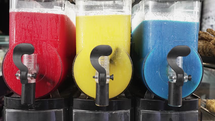Colorful lemonade, orange juice and water in street dispenser machine | Shutterstock HD Video #1101548991