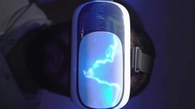 Man removes VR headset after immersive experience, back to reality; vertical - Powered by Shutterstock - Get 15% off with code: PIKWIZARD15