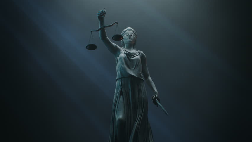 Cinematic and Atmospheric Shot of Lady Justice Sculpture. The Statue is Blindfolded and Holding Scales and Sword.
A Title Sequence for Court Show Mock-up. Royalty-Free Stock Footage #1101553895
