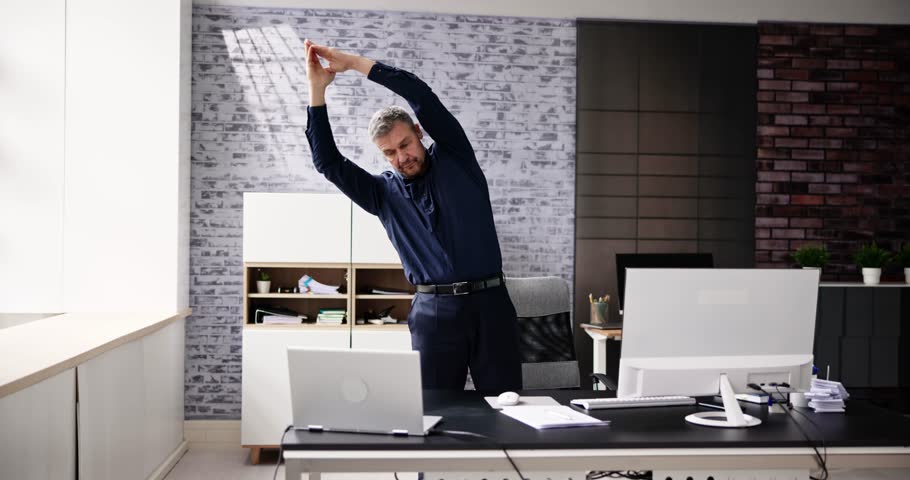 Arms Stretch Exercise Standing Near Desk In Office Royalty-Free Stock Footage #1101555701