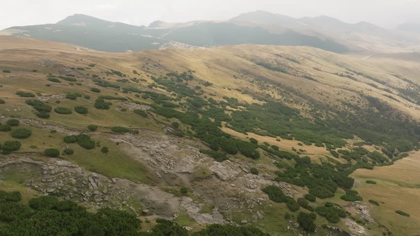 Aerial view, Romanian mountain range, beautiful lanscape down below.
