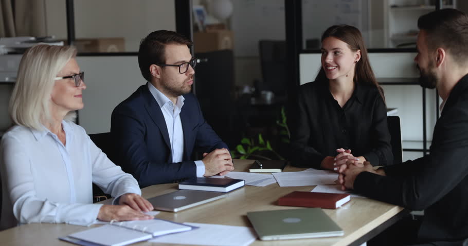 Businesspeople make agreement, decision and profitable deal, finish planning cooperation express respect shake hands accomplish meeting in modern conference room. Successful negotiations, business Royalty-Free Stock Footage #1101557199