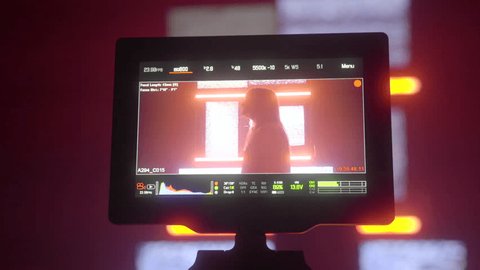 Closeup Behind the Scenes Footage of Silhouetted Woman Singing for Music Video in Abstract Dark Studio Light Adlı Stok Video
