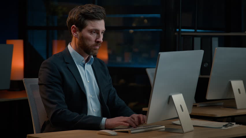 Focused pensive businessman Caucasian 40s middle-age man boss entrepreneur thinking business plan pondering ideas working in evening office thoughtful male search solution think solve computer problem Royalty-Free Stock Footage #1101595465