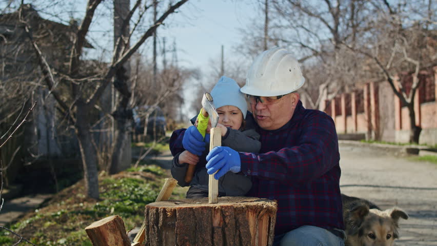 Building a home is a family affair for this grandfather, son, and boy. Together, they learn construction safety and work with firewood, tape measures, and an ax