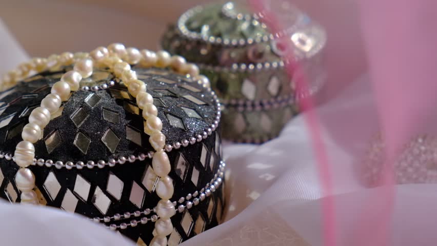 Indian traditional store close-up. Beautiful jewelry boxes, pearls, silk, chiffon