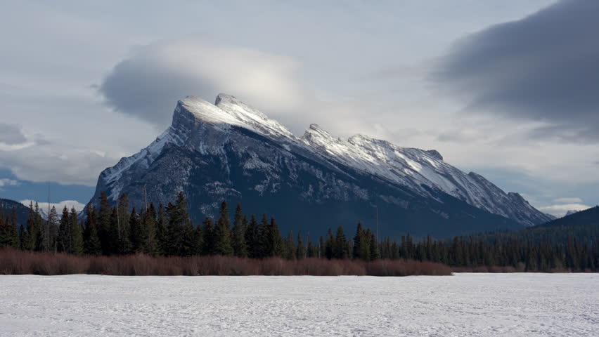 Beautiful view of Frozen Vermillion Lake with Mount Rundle and snow covered in winter on sunny day at Banff national park, Alberta, Canada