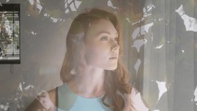 Animation of light spots and leaves over portrait of happy caucasian woman. Lifestyle and domestic life concept digitally generated video.