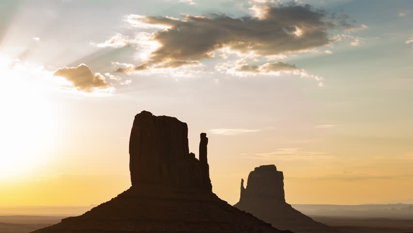 Monument Valley Sunrise West and East Mitten Butte Time Lapse Tilt Down Arizona Southwest USA