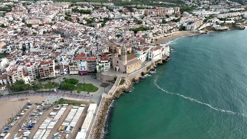 Sitges church aerial view. Drone footage of mediterranean coast, Costes del Garraf. Església de Sant Bartomeu. | Shutterstock HD Video #1101607713