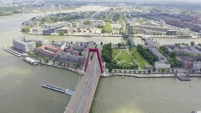 Inscription on video. Rotterdam, Netherlands. Rotterdam Bridges - Williamsburg Suspension Bridge, De Hef Drawbridge and Koninginnebrug Bridge. Arises from blue water, Aerial View