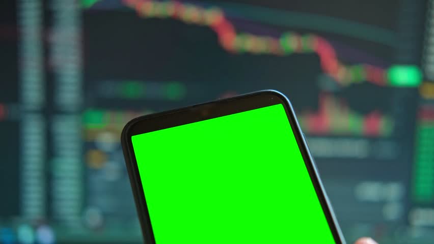 Black phone with blank mockup screen on rising stock graph. Closeup hand showing smartphone isolated green display. Online banking, Fund App use. Financial analyst on Invest Market. Bank collapse 2023 Royalty-Free Stock Footage #1101610947