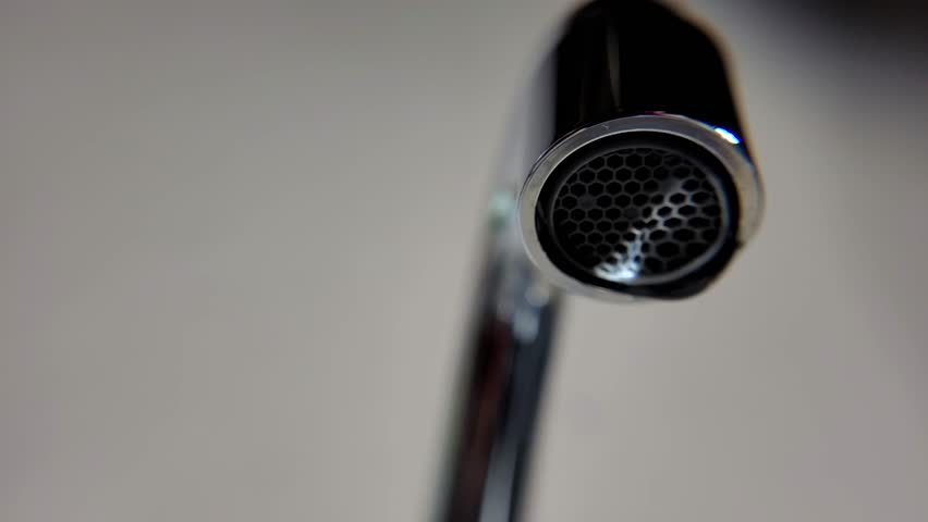 Drops of water, water drops falling from a faucet in slow motion, 4k, natural light, selective focus. | Shutterstock HD Video #1101612967