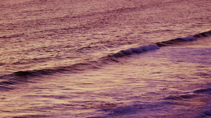 Ocean waves in contrasting orange sunlight on an ocean shore in a calm windless weather, Phillip Island, Victoria, Australia | Shutterstock HD Video #1101614327