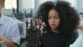 Group Kid teen child enjoy Machine Learning Robot arm is Moving Under coding Control robot at stem technology class, stem education for digital automation learn for use artificial intelligence ai - Powered by Shutterstock - Get 15% off with code: PIKWIZARD15