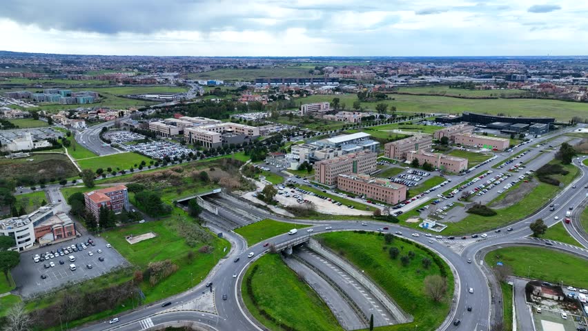 Tor Vergata neighborhood in Rome, Italy.
Aerial view of the modern road system and university buildings.