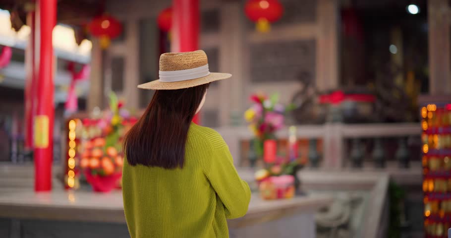 Woman pray for herself in Chinese temple