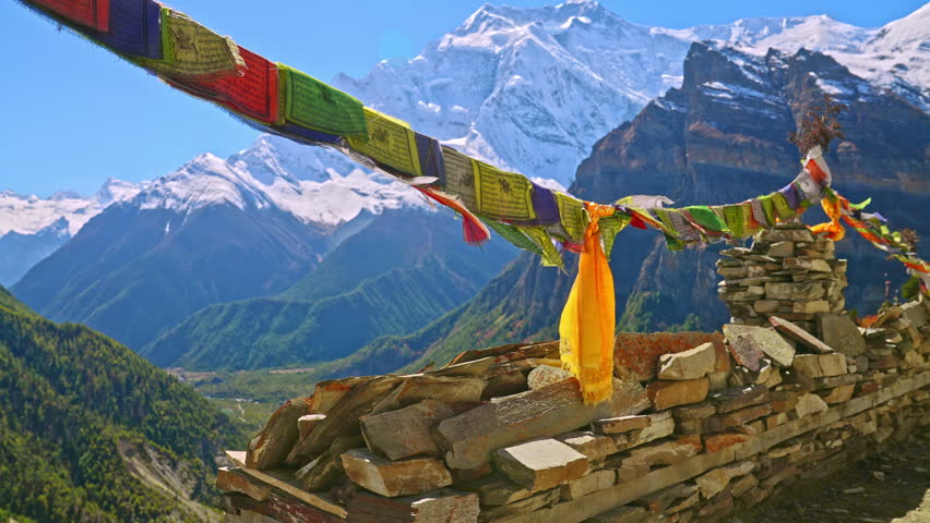 Colorful Buddhist prayer flags at a viewpoint overlooking the Annapurna mountain range, Nepal Royalty-Free Stock Footage #1101628135
