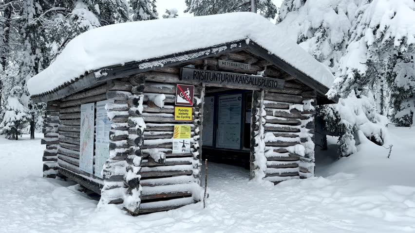 Video shot of Riisitunturi Park in winter in Lapland. Amazing mountainous area with big hilly swamps and highly snowy. Trees completely covered in a thick blanket of snow and ice. Snowshoeing. Sci.