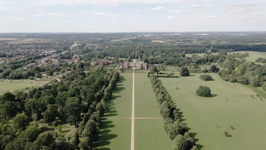 Aerial view towards majestic Hatfield house Tudor mansion, parkland and glorious landscaped gardens
