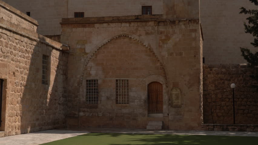 The camera tilts the magnificent bell tower of Mor Behnam Church, one of the most important churches of Mardin, from bottom to top.