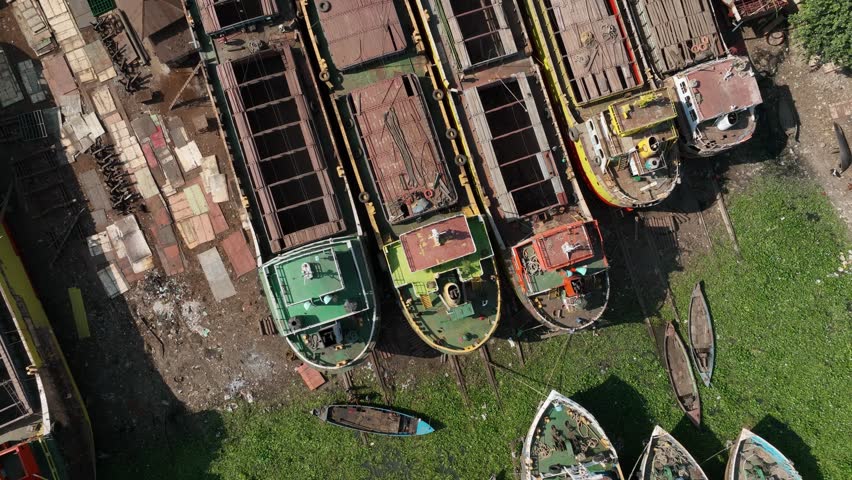 Topside rotating aerial view of large shipyard in Dhaka, Bangladesh. Royalty-Free Stock Footage #1101639301