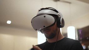 guy playing a game in virtual reality glasses - Powered by Shutterstock - Get 15% off with code: PIKWIZARD15