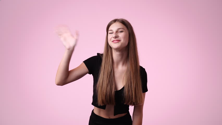 4k video of girl with cunning facial expression on pink background. | Shutterstock HD Video #1101641383