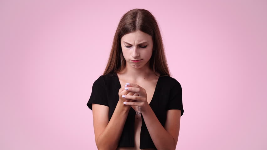 4k video of a woman thinking about something over pink background. | Shutterstock HD Video #1101641419
