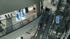 CCTV with facial recognition identifies people in a crowd. Scanning persons on an escalator in a shopping mall with a security video camera. Interface of software that uses big data analysis. 4k